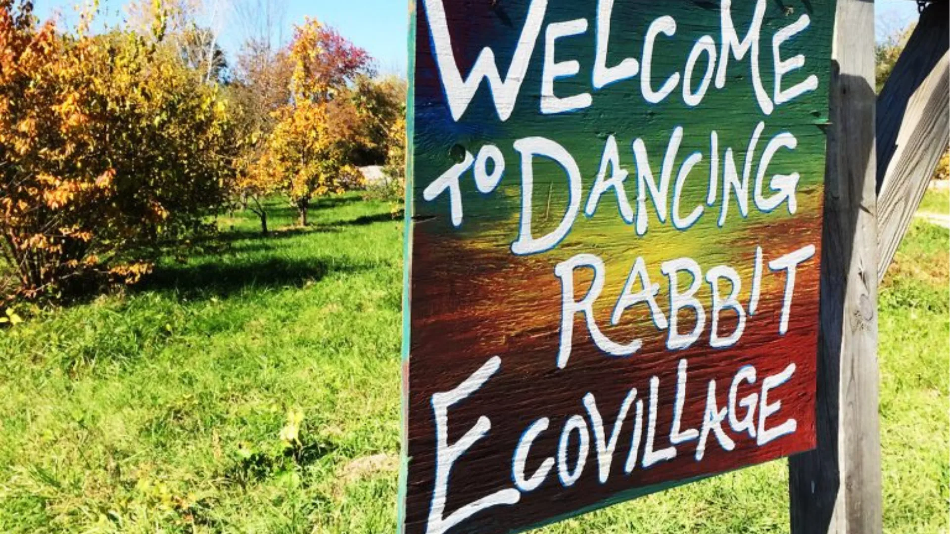 Hand-painted ‘Welcome to the Ecovillage’ sign
